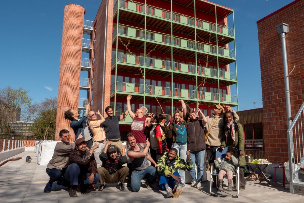 Residents posing together on the roof terrace