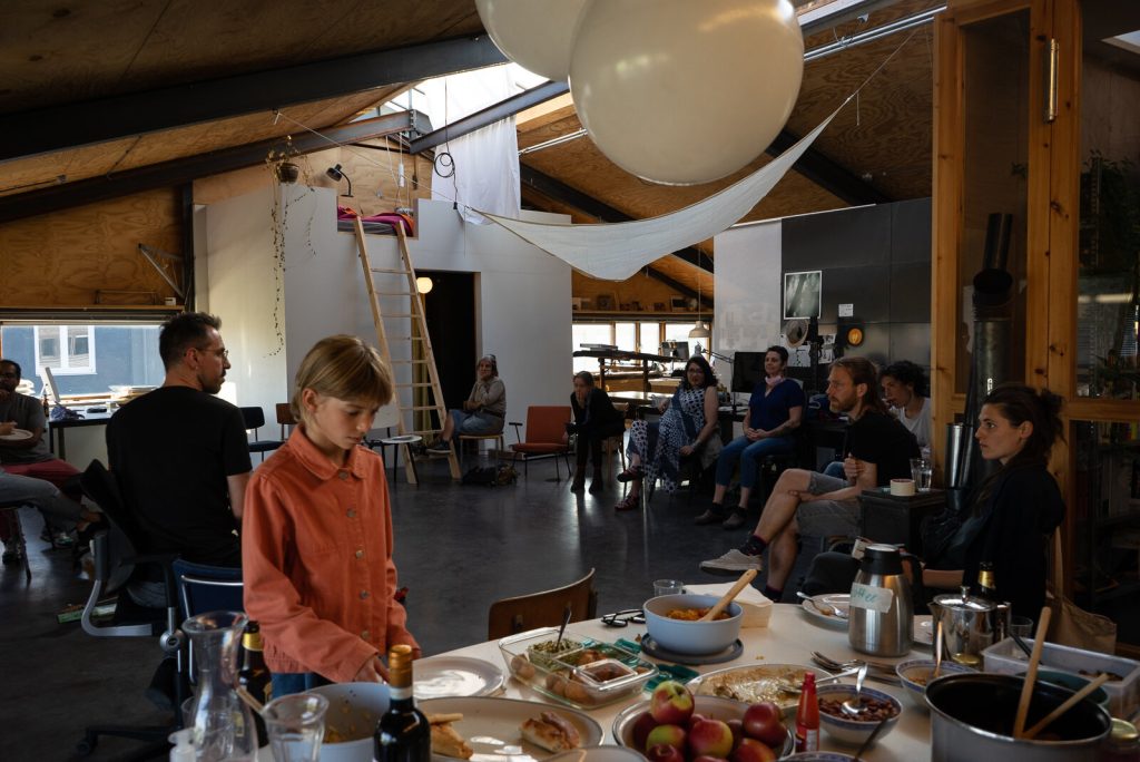 A shared dinner in a timber hall