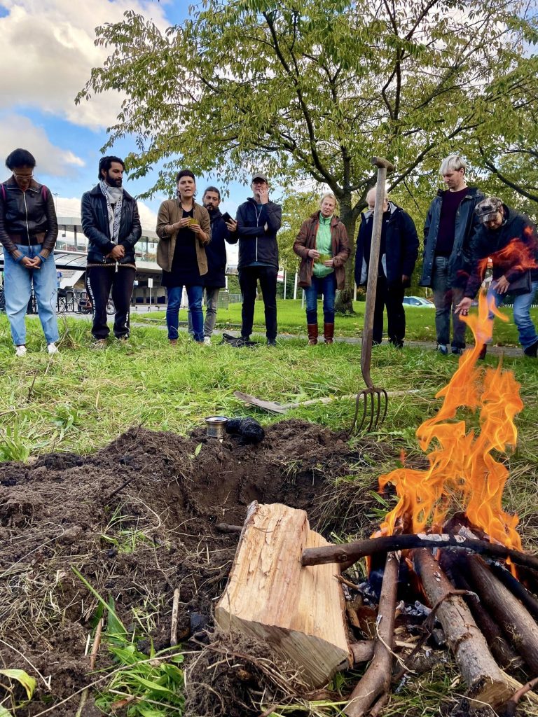 A small fire on the plot during a gathering